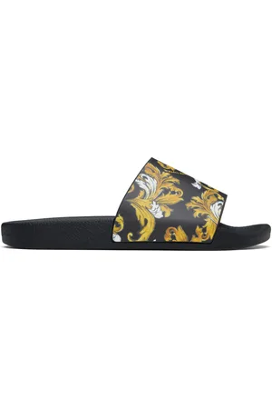 VERSACE Sandales à enfiler noir et doré à motif Barocco