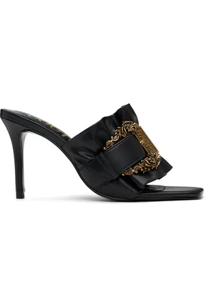 VERSACE Mules Emily noires à boucle Baroque