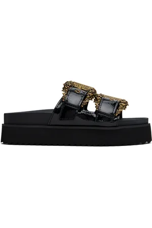 VERSACE Sandales Arizona noires à boucles à motif baroque