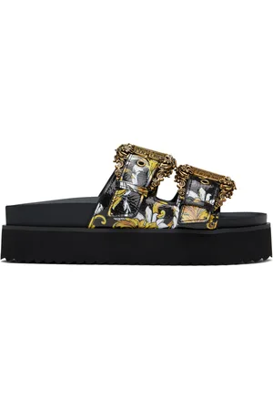 VERSACE Sandales Arizona noires à motif Outline Barocco