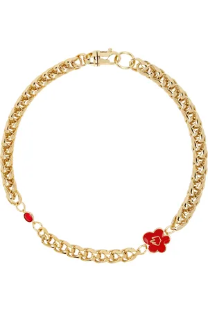 In Gold We Trust Collier doré à breloque de fleur et à pierre du Rhin