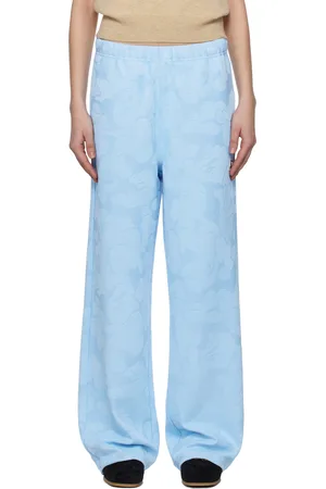 BAPE Pantalon de détente ample bleu à motif camouflage en jacquard et à plaque à logo