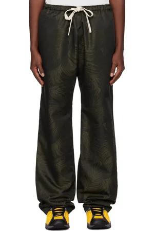 Palm Angels Pantalon de détente noir et kaki à motif de palmiers en jacquard