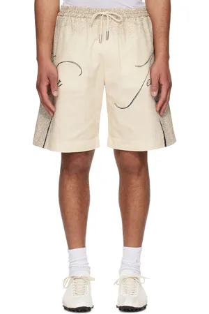 Jean Paul Gaultier Short beige à imprimés de style tatouage