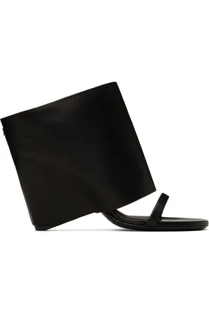 Courrèges Mules à talon compensé noires en cuir - Oblique