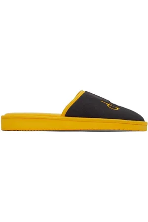 Drew House Pantoufles noir et jaune à logo griffonné exclusives à SSENSE
