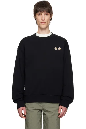 Givenchy Pull molletonné noir en coton à appliqués
