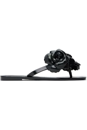 COPERNI Tongs noires en silicone à appliqués floraux