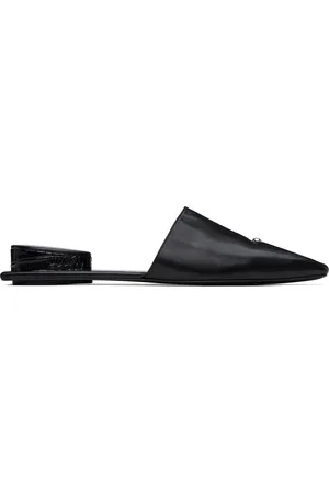 Tory Burch Mules noires à ferrure de style perçage