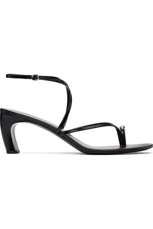 Tory Burch Sandales à talon noires à brides entrecroisées et à ferrure de style perçage