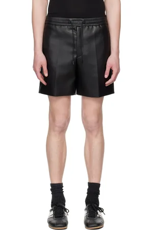 SYSTEM Short noir en cuir synthétique à cordon coulissant exclusif à SSENSE