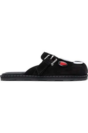 Moschino Mules de sport noires en suède de vache