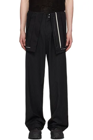 Andersson Bell Pantalon noir à assemblage inversé et à rayures
