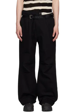 Andersson Bell Pantalon ample noir à taille asymétrique