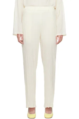 Issey Miyake Pantalon blanc cassé en laine - Karami