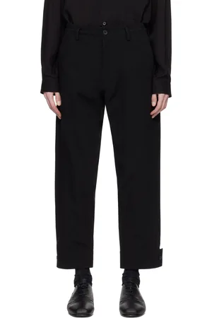 YOHJI YAMAMOTO Pantalon noir à patte boutonnée aux revers
