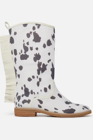 Stella McCartney Bottes western a franges avec motif vaches, Femme